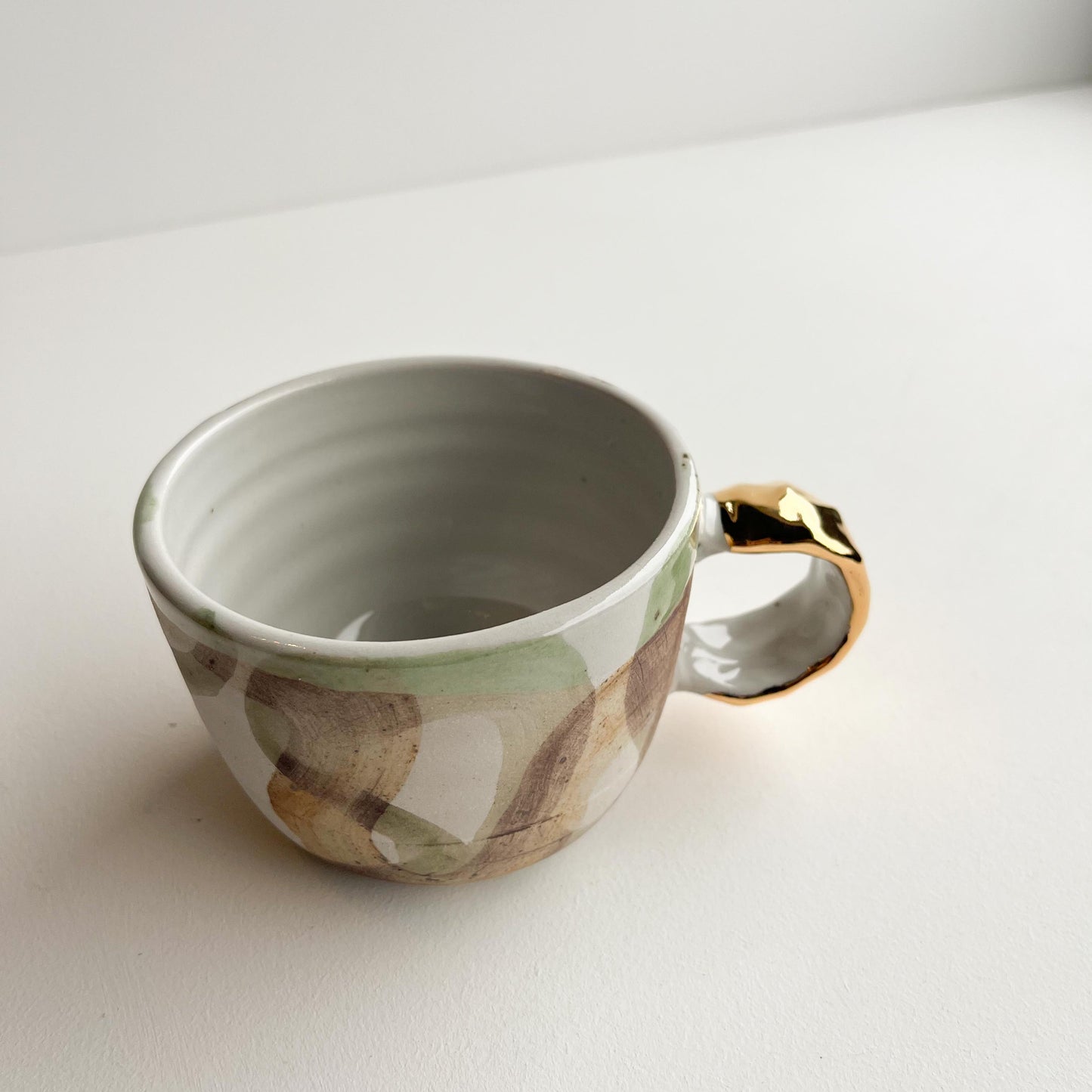 Terrance wave gold handle cup