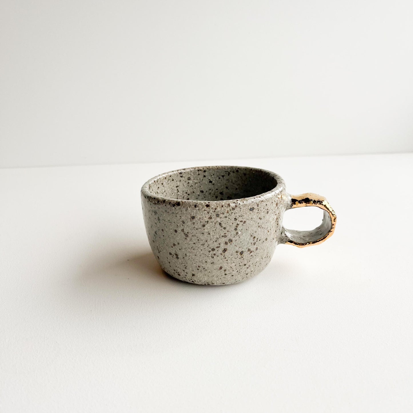 Speckle gold handle cup
