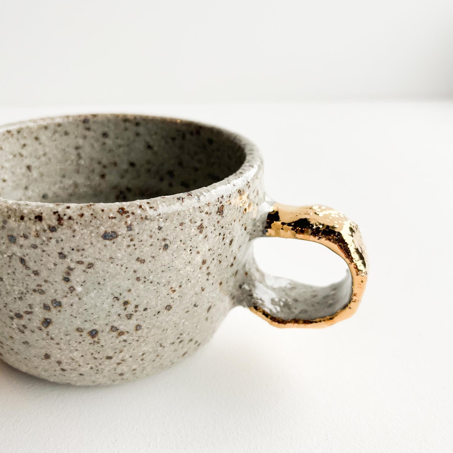 Speckle gold handle cup
