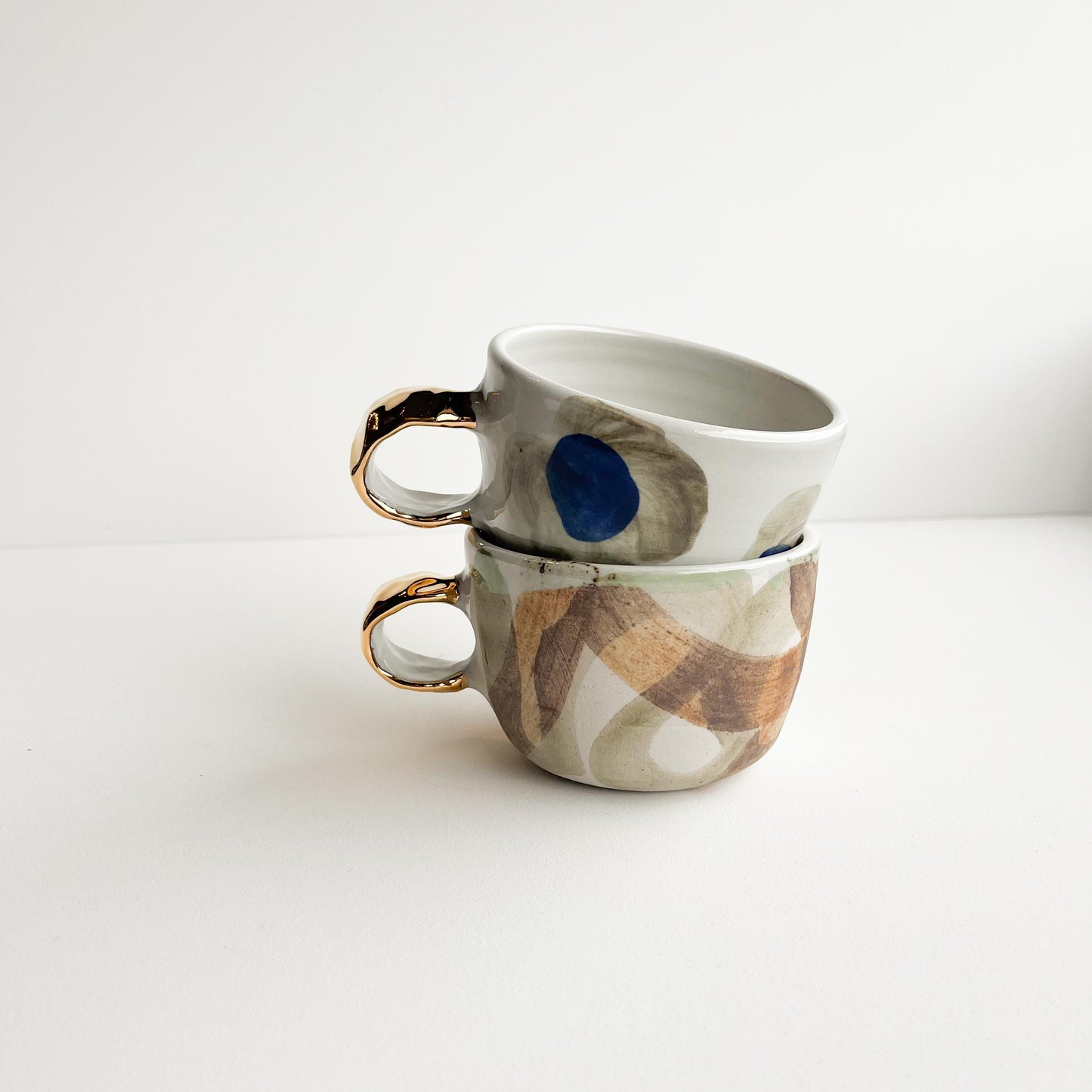 Rick and Jude gold handle cups