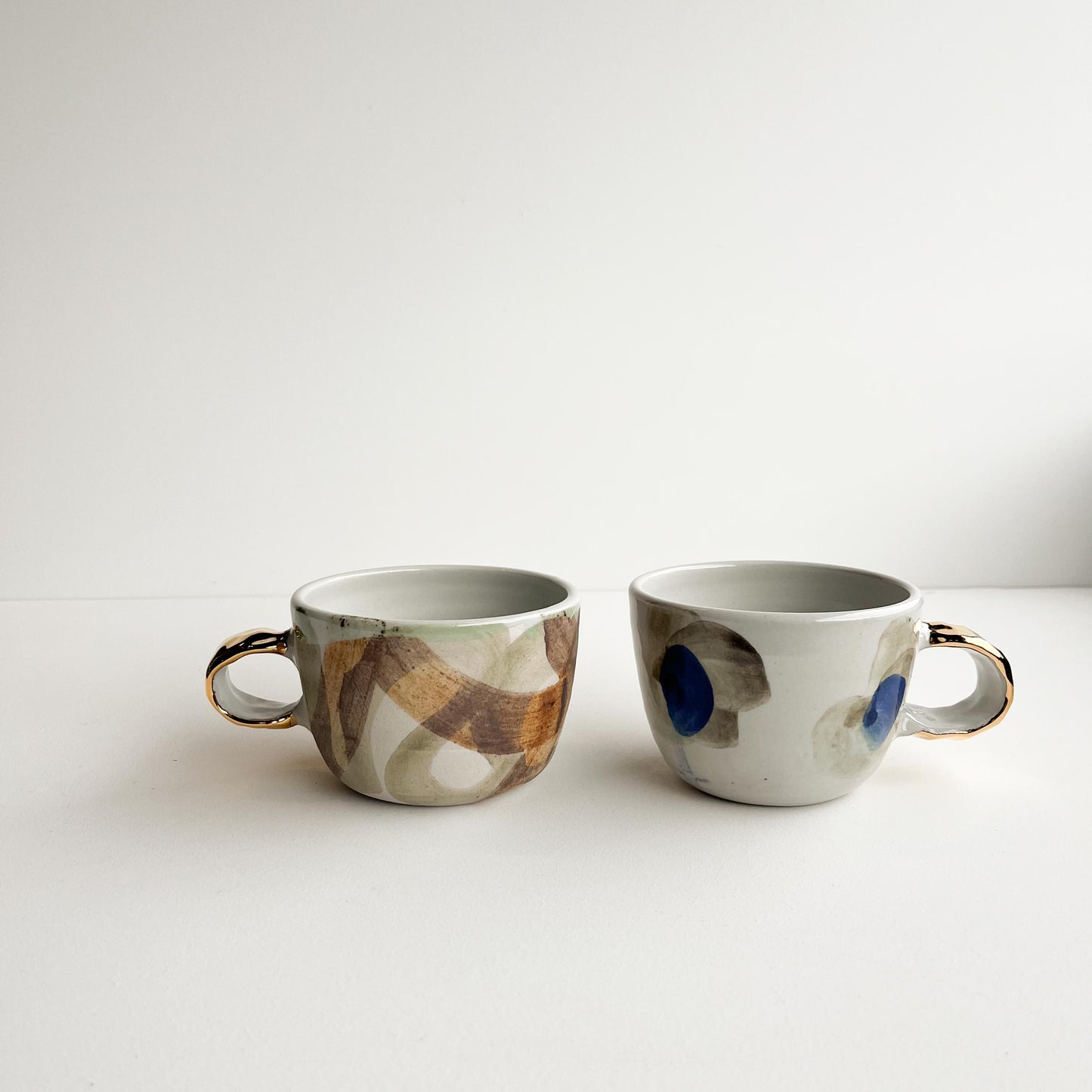Rick and Jude gold handle cups