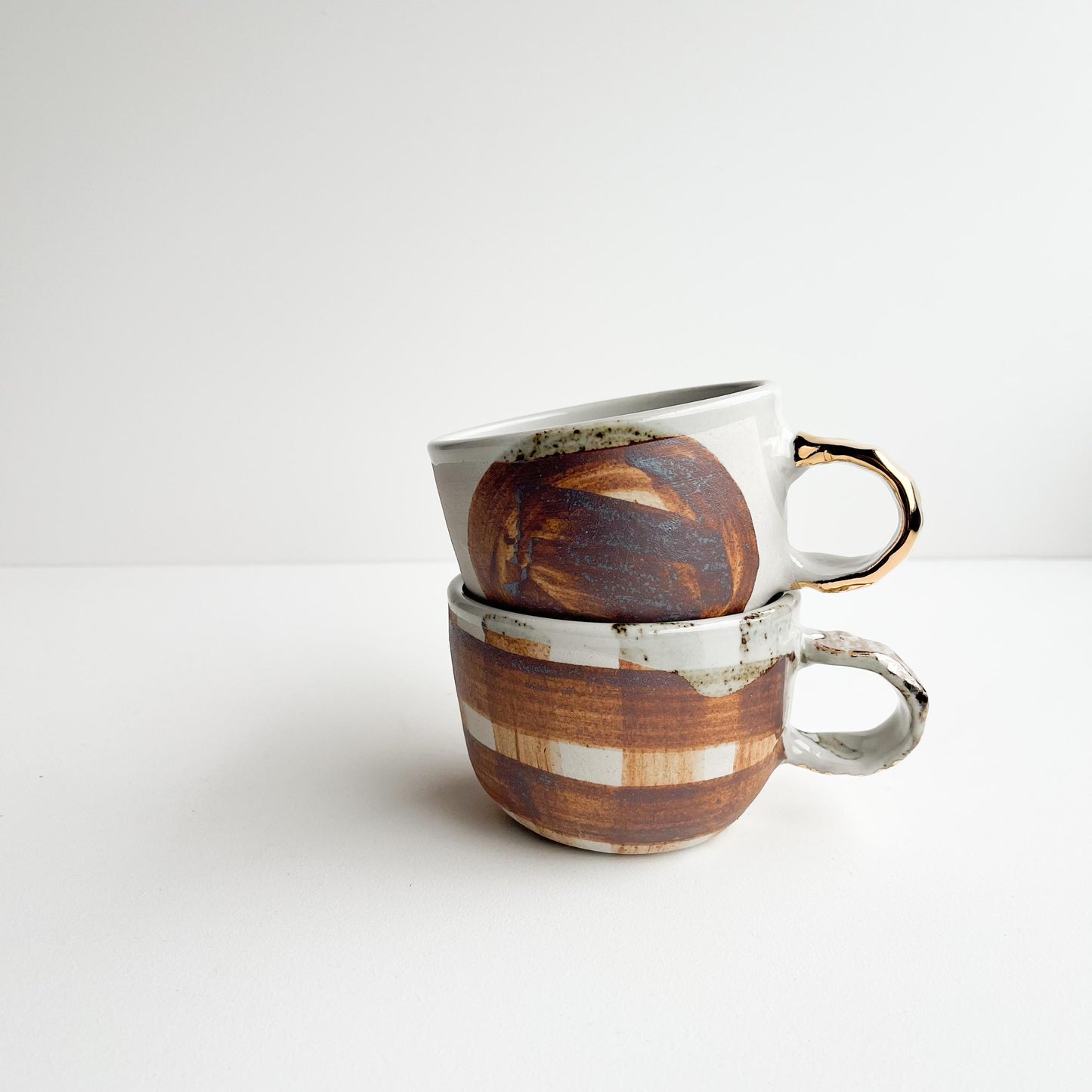 Justine and Jill gold handle cups