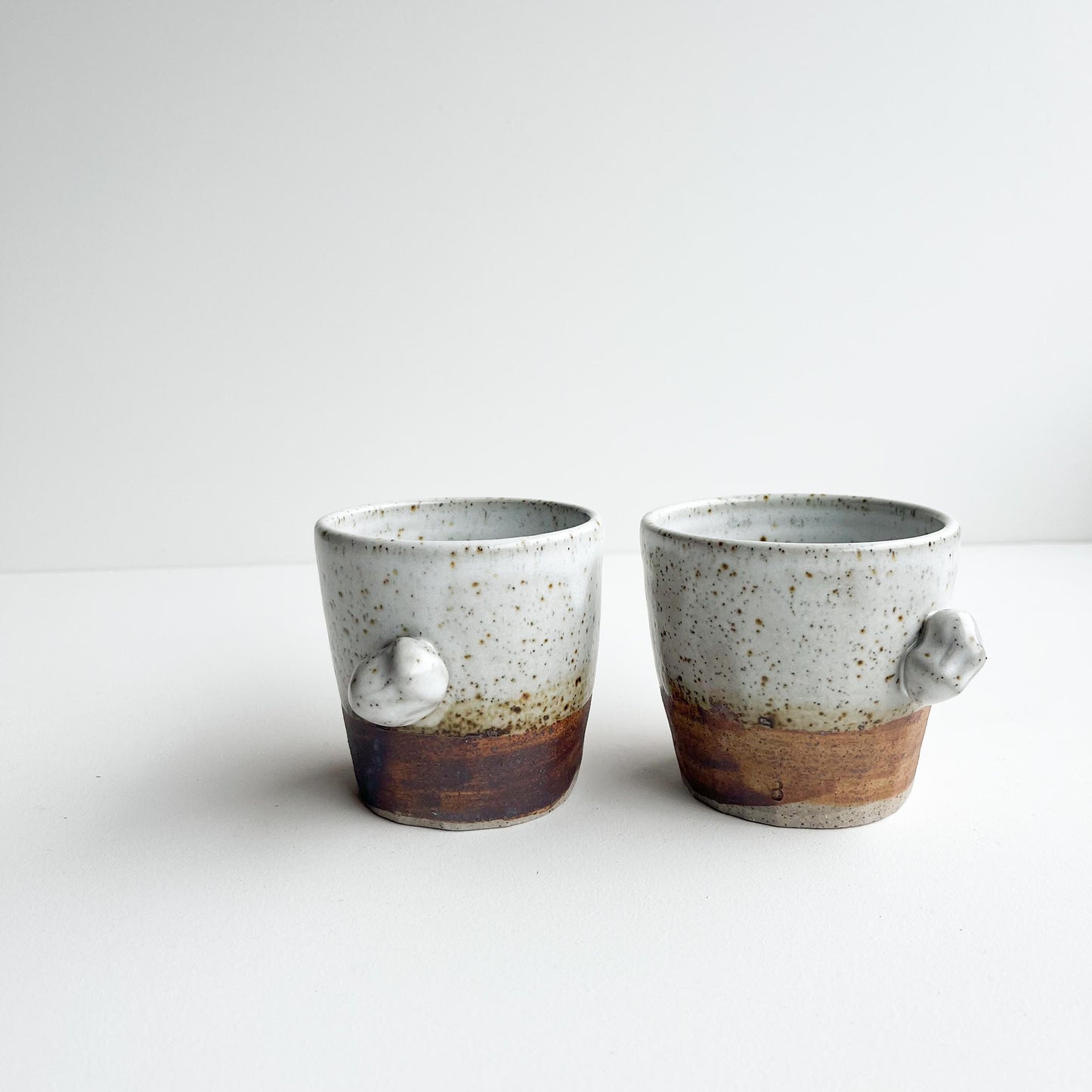 Rick and Red white button cups