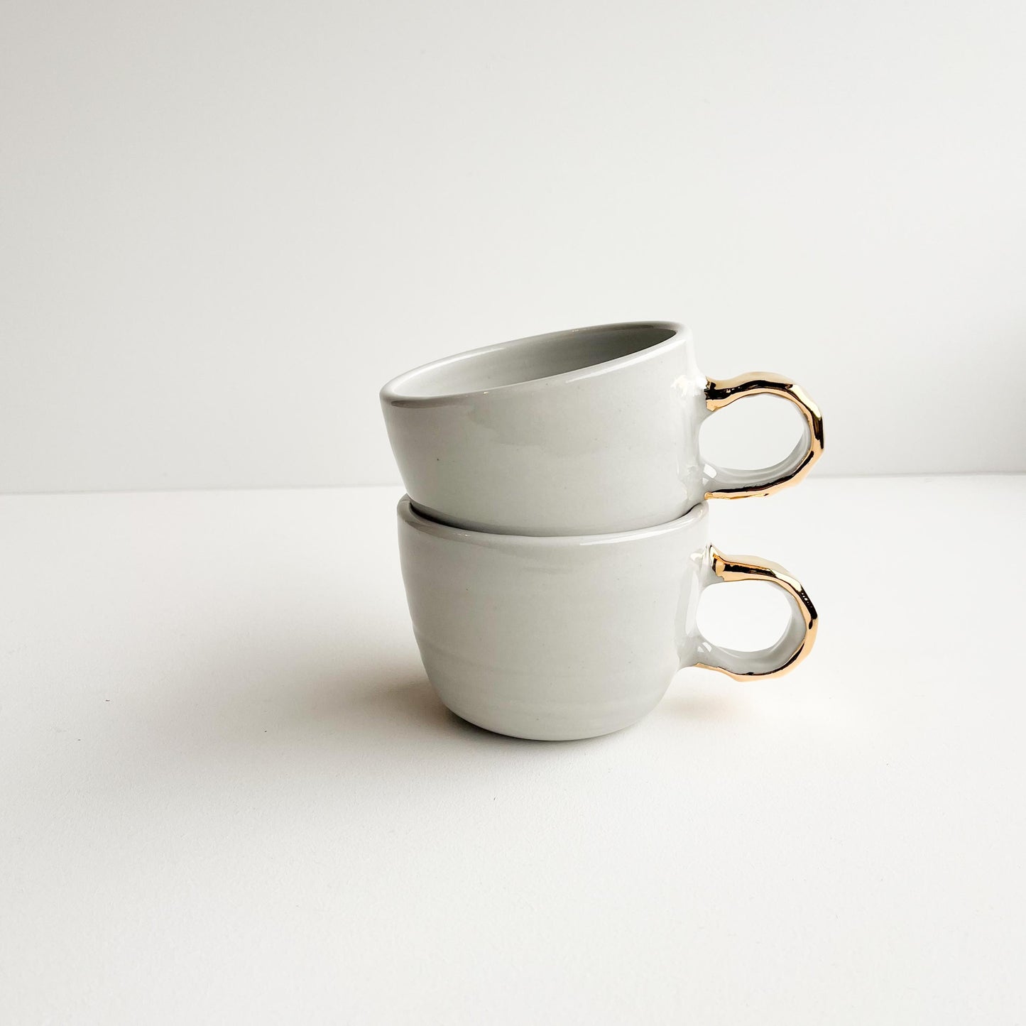 Sally and Sue gold handle cups