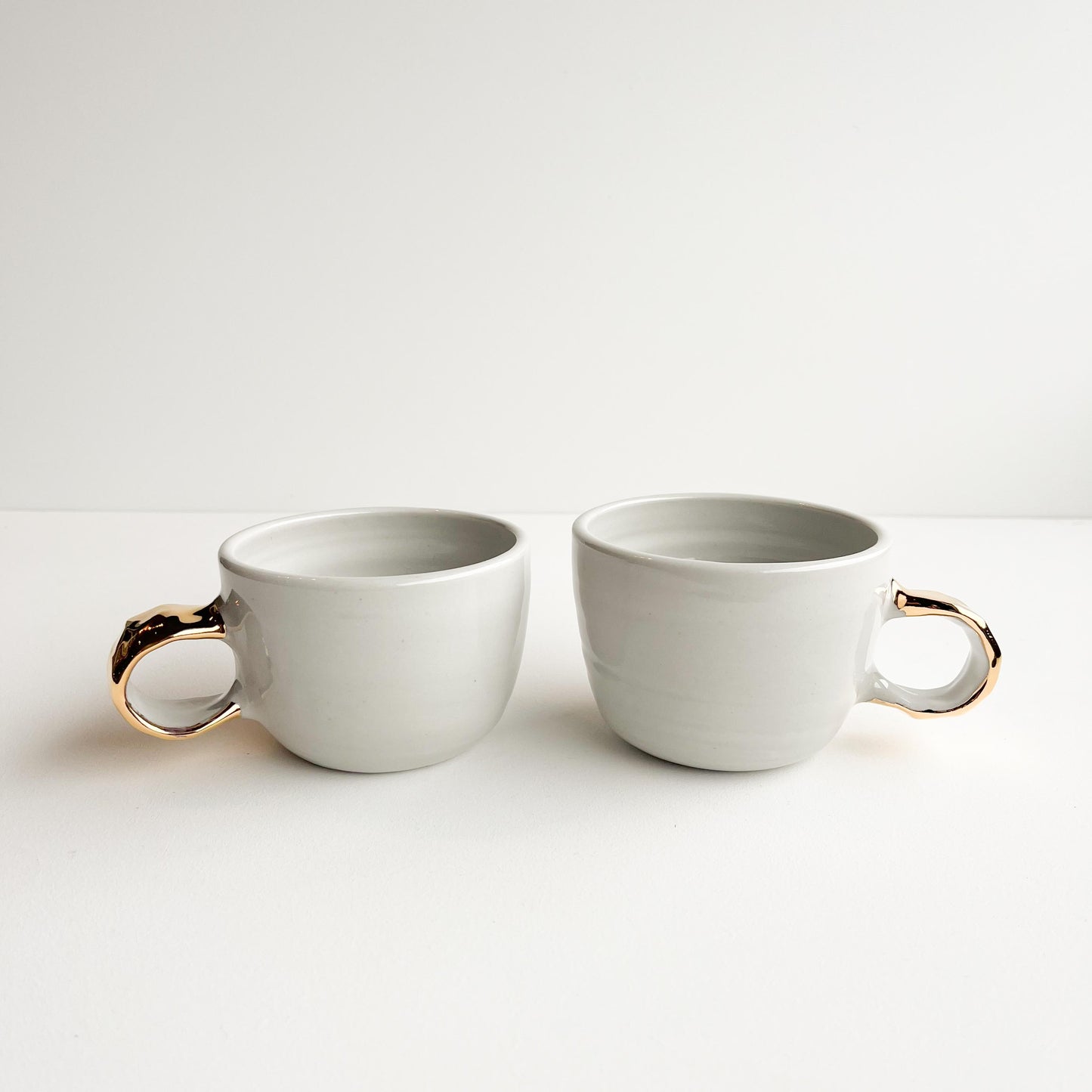 Sally and Sue gold handle cups