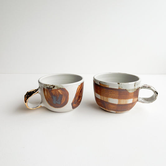 Justine and Jill gold handle cups