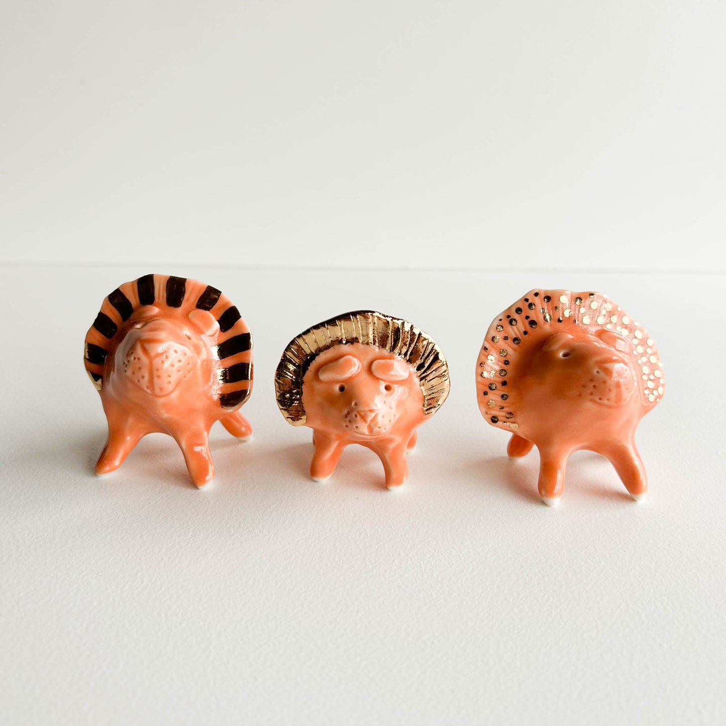 Porcelain Lion small orange GOLD STRIPE