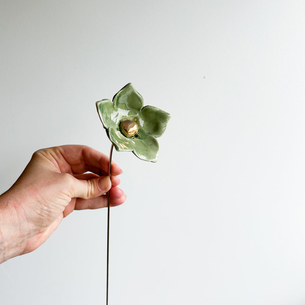 Large porcelain flower on brass