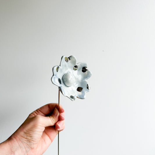 Large porcelain flower on brass