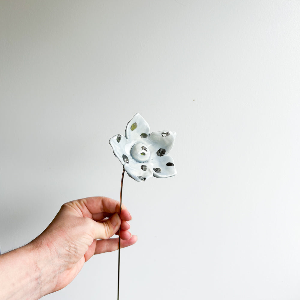Large porcelain flower on brass