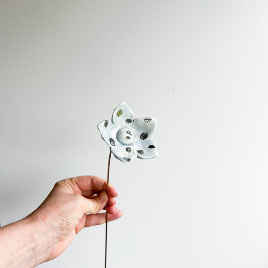 Large porcelain flower on brass