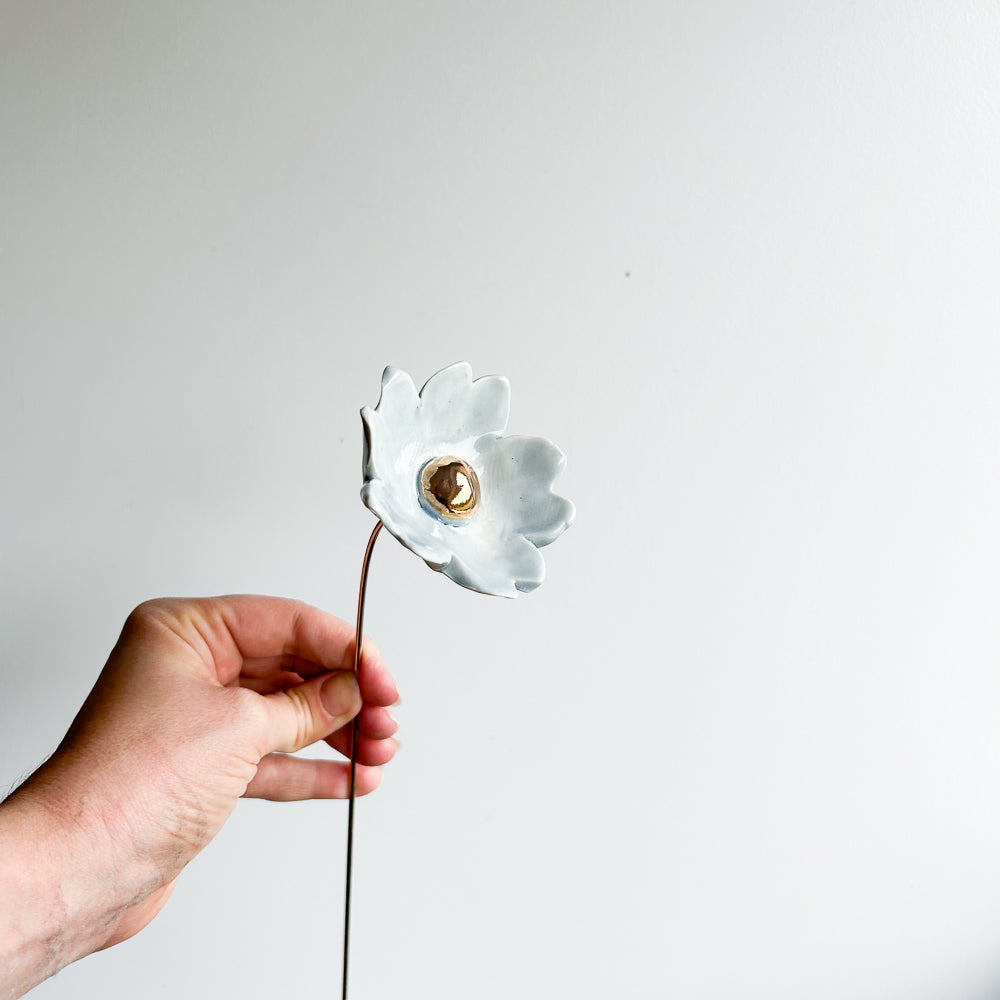Large porcelain flower on brass