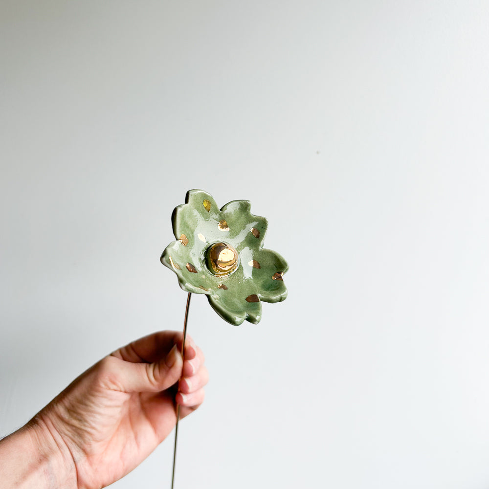 Large porcelain flower on brass