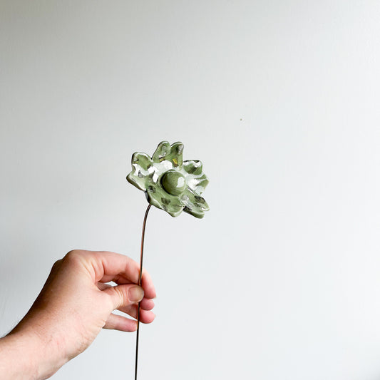 Large porcelain flower on brass