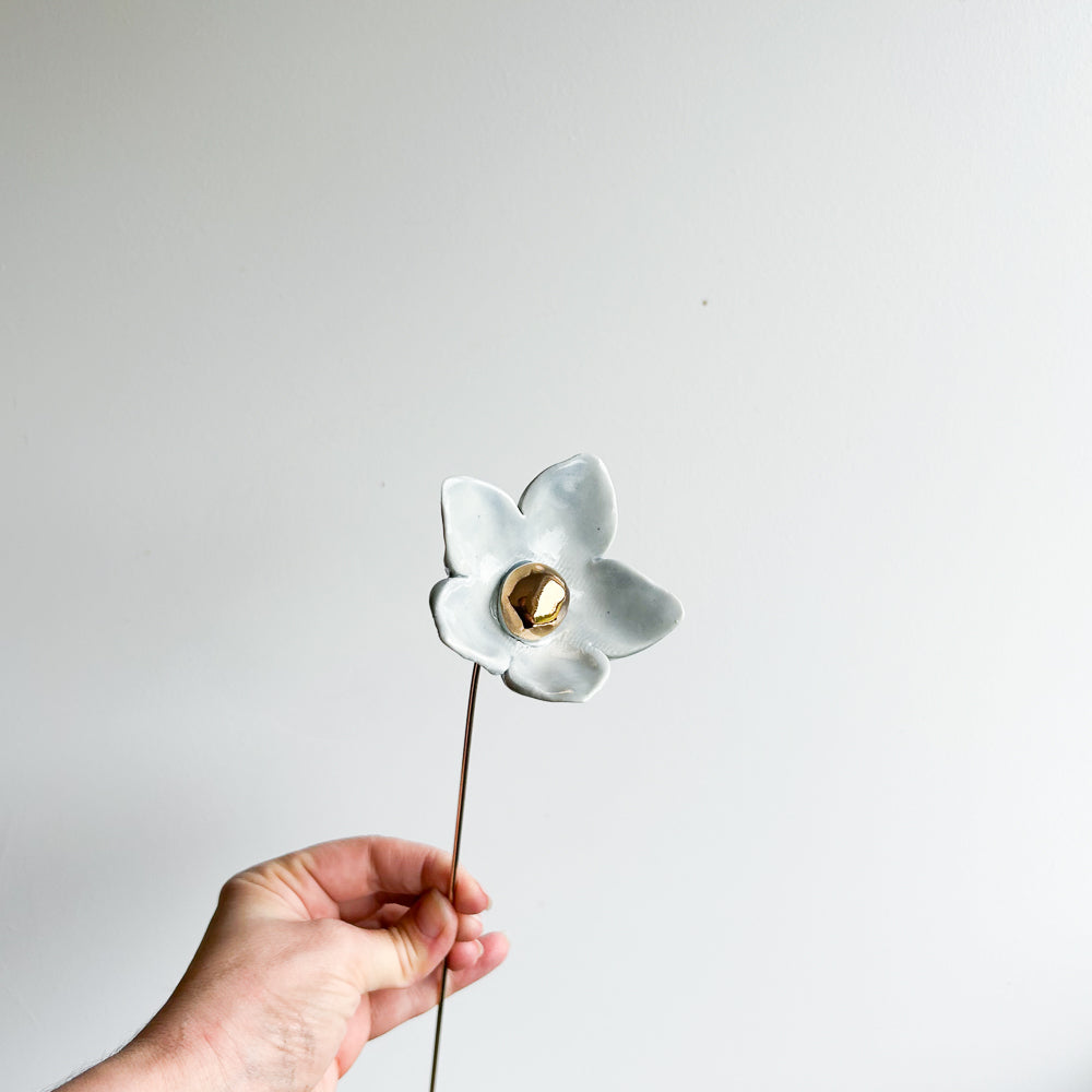 Large porcelain flower on brass